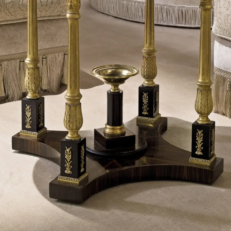 Lavish Provasi 1228 side table with ebony basement, rhythmic carved legs treated with gold light patina, and sleek glass tabletop