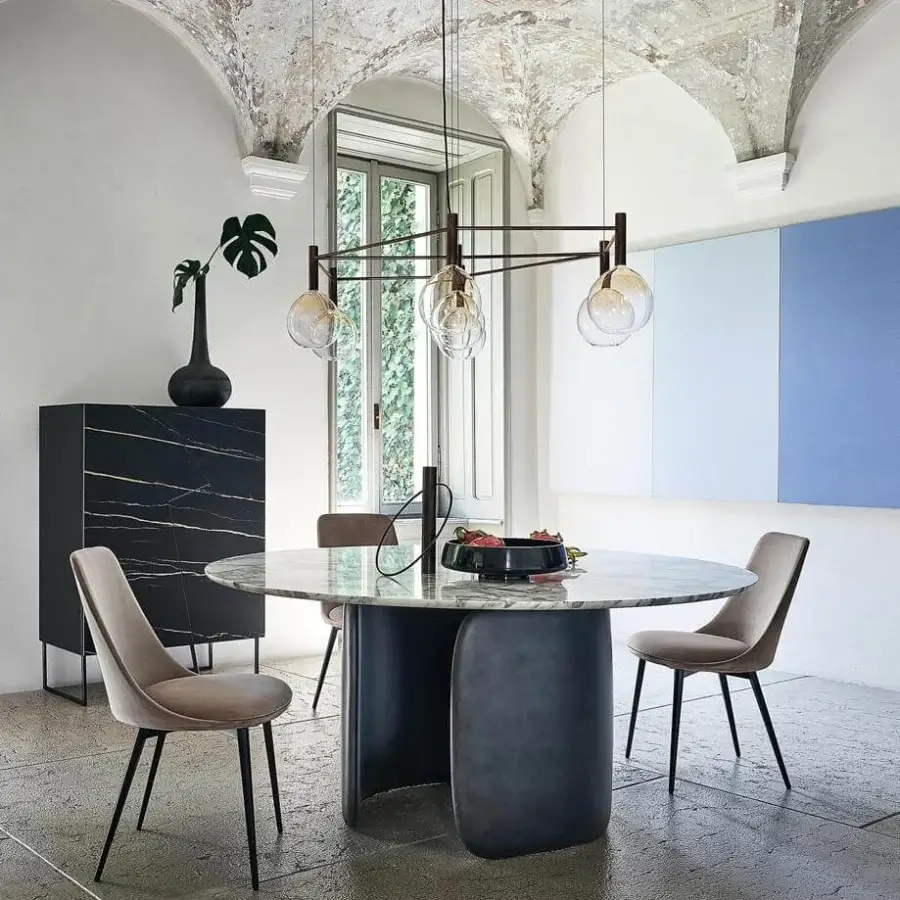 Distinguished Bonaldo Mellow table with a round marble-patterned top and dark matte rigid polyurethane base