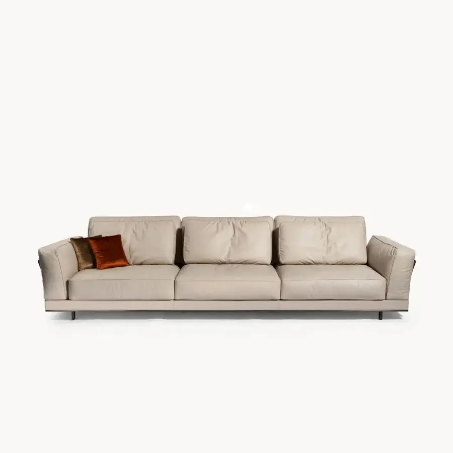 Distinguished Visionnaire Anthem sofa with neutral beige textured leather and elegant metal bordering