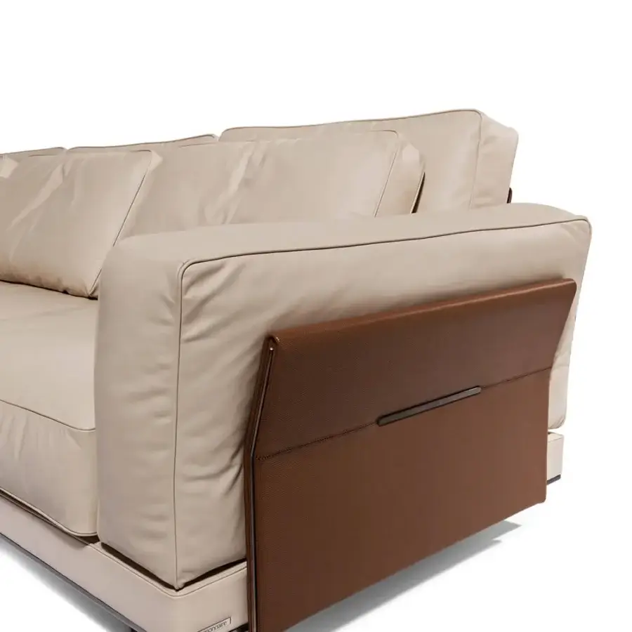 Distinguished Visionnaire Anthem sofa with plush light beige leather and satin-finish medium-toned brown wood paneling