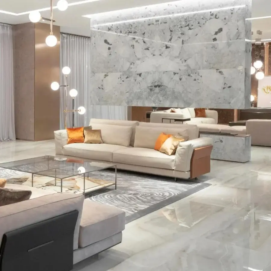 Exceptional Visionnaire Anthem sofa with light beige textile upholstery and contrasting warm orange accent cushions