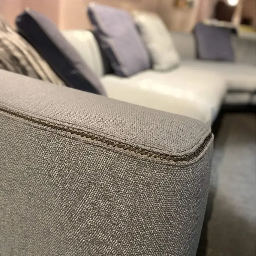 Distinguished Borzalino Franklin L sectional with textured medium gray woven fabric upholstery and elegant piping