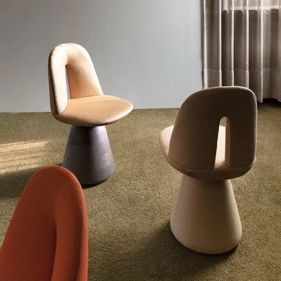 Superior Carpanese Home Bill chair with terracotta-orange textile upholstery and satin wood conical base