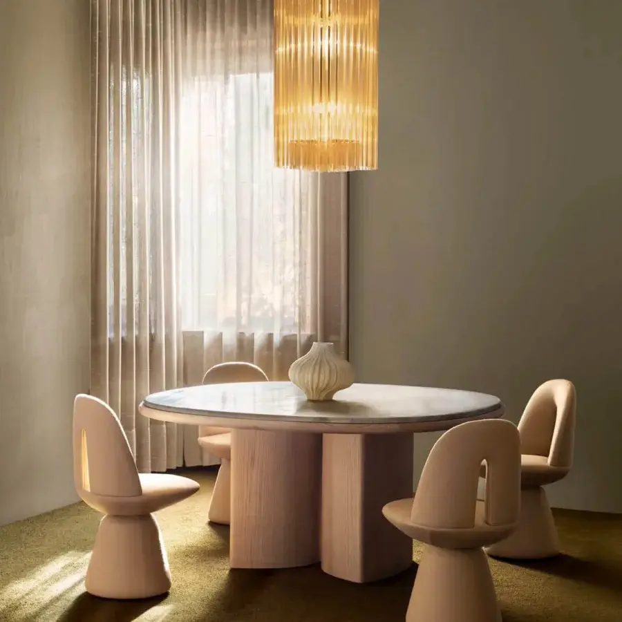 Elegant Carpanese Home Bill chair, a dining or accent seat upholstered in peach with a smooth matte finish