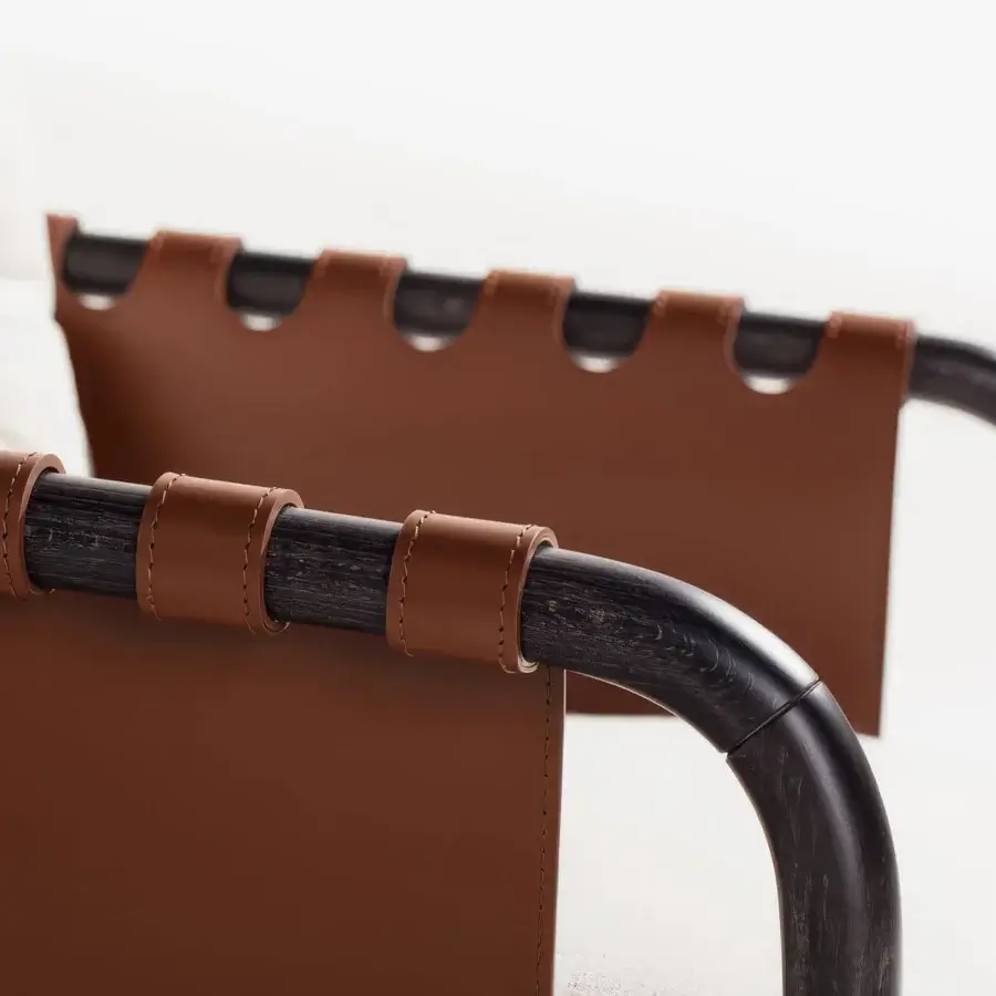 Refined Carpanese Home Bridge lounge chair with solid beech wood frame and reddish-brown handcrafted leather detailing