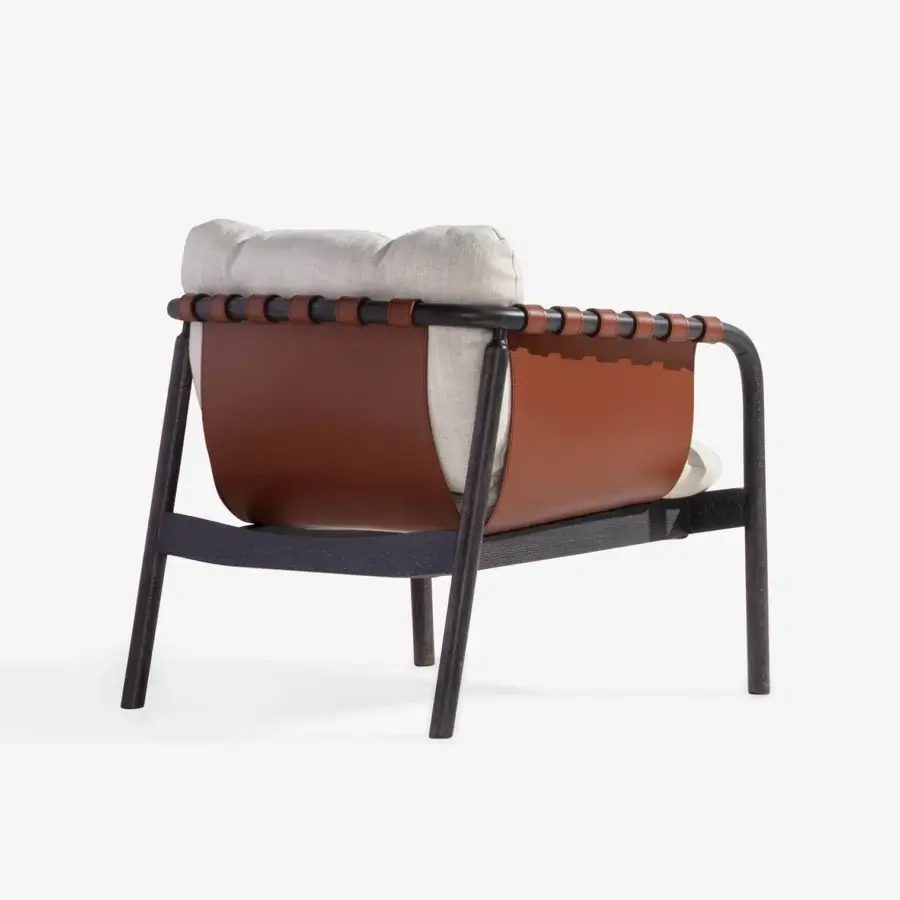 Exceptional Carpanese Home Bridge lounge chair with solid beech wood frame and reddish-brown handcrafted leather panels with light textile cushions