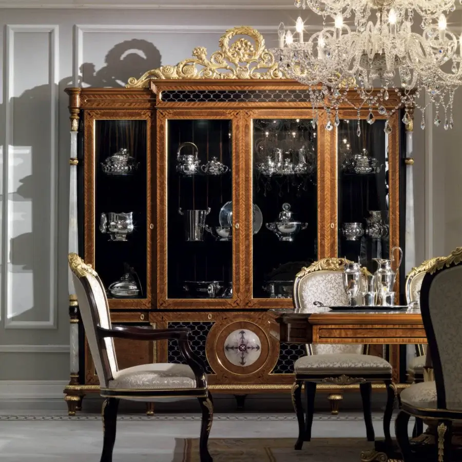 Superior Armando Rho 1167 cabinet crafted in satinwood with walnut burl and ebony accents, exhibiting a gilded metal finish