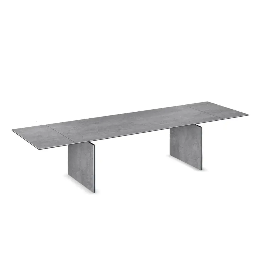 Elegant Naos Convivium extendable table built with stone and porcelain ceramic, showcasing a textured matte finish in medium gray