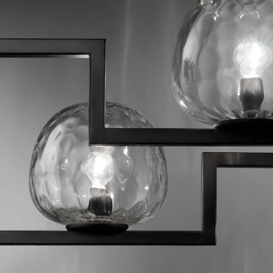 Distinguished Vistosi Globose suspension lamp crafted in black matte iron with luminous clear glass diffusers