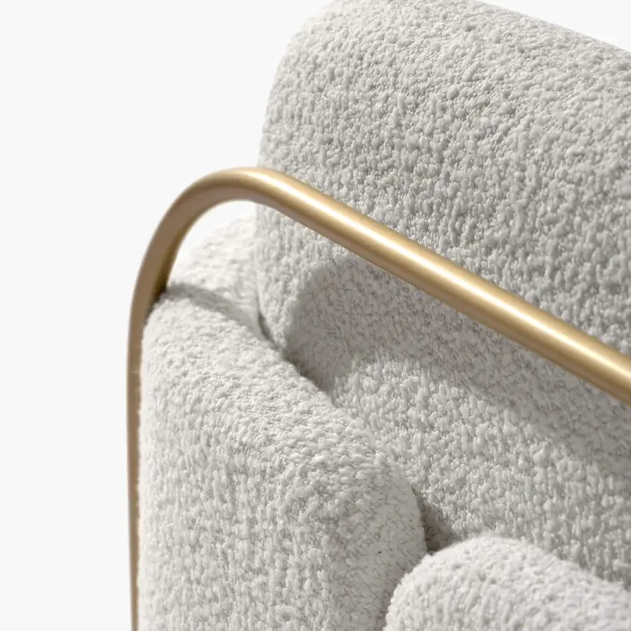 Sophisticated Carpanese Home Gaston lounge chair in textured light gray bouclé fabric with satin Brass metal framing