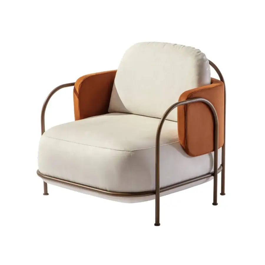 Distinctive Carpanese Home Gaston lounge chair with creamy fabric upholstery and reddish-brown leather armrests in satin Brass metal