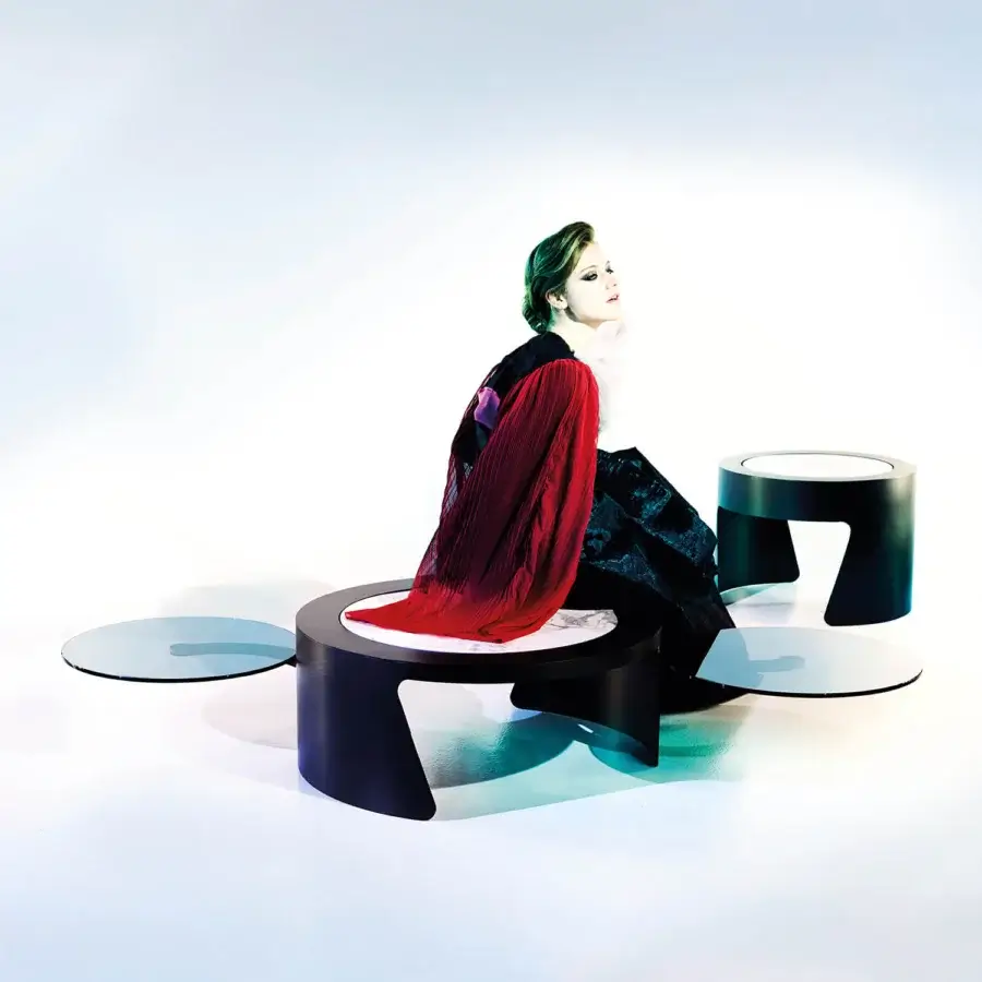 Superior [Brand] Discovery coffee table with a rotating ceramic stone top and clear glass surface in dark wood and painted frame