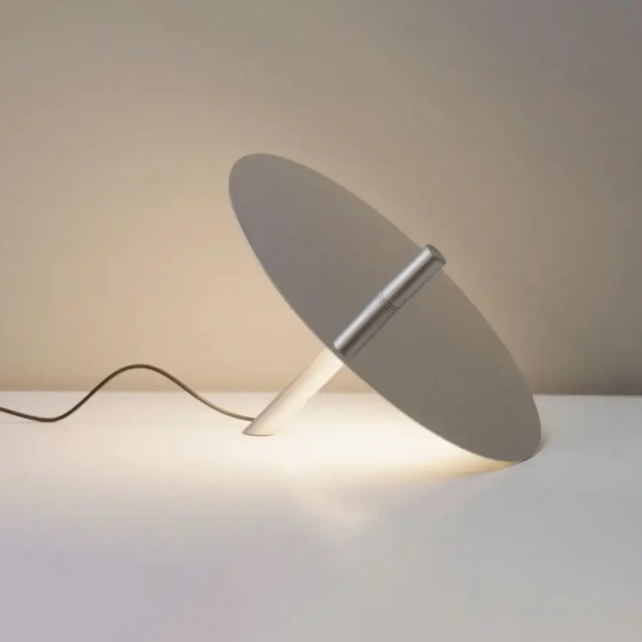 Elegant Luceplan Millimetro lamp with a slender aluminum stem and ultra-thin reflective disc in a neutral gray matte finish