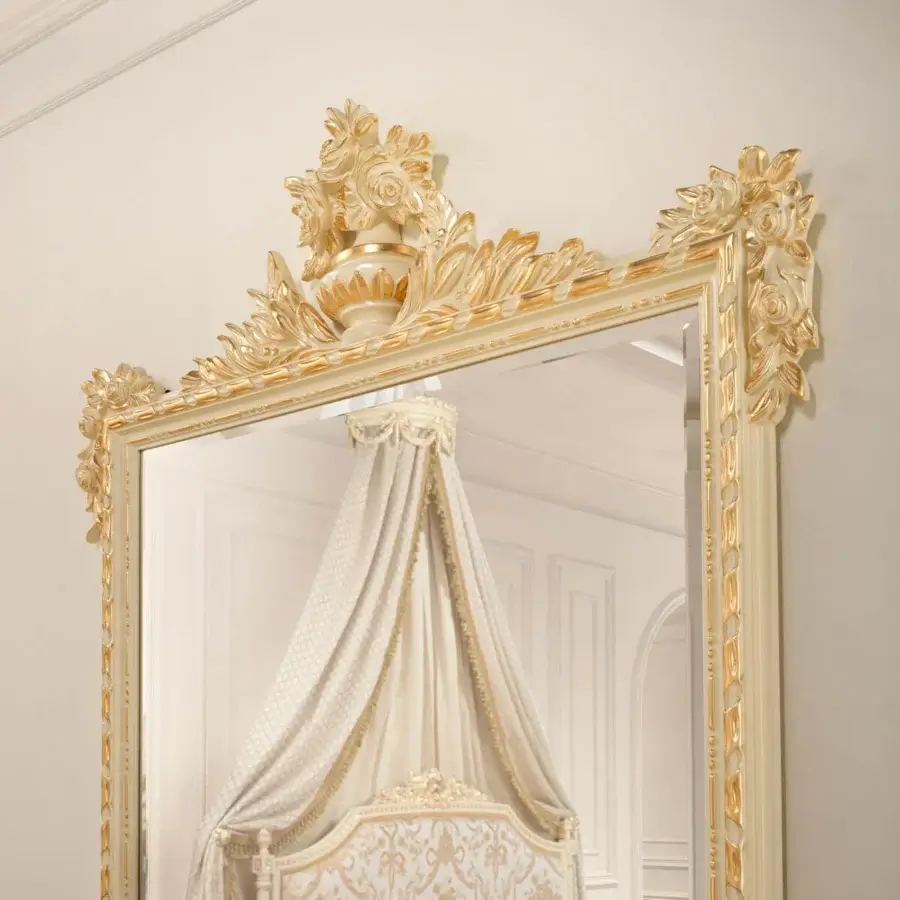 Distinguished Modenese Golden Radiance mirror crafted in Italy with an ornate, glossy golden wood frame and elaborate floral detailing