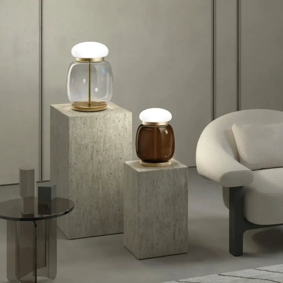 Elegant Vistosi Faro table lamp with clear and amber tinted glass plus a glossy white base and satin finish metal ring