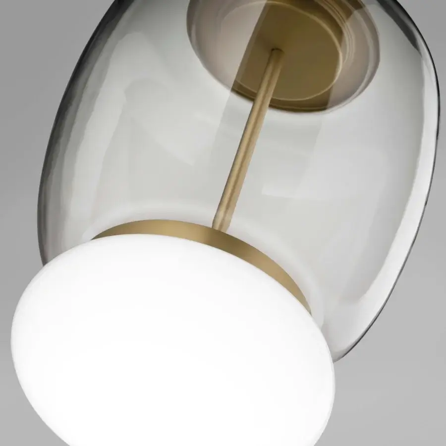 Elegant Vistosi Faro suspension lamp crafted in hand-blown glass with clear to smoky gray gradient and satin gold metal ring