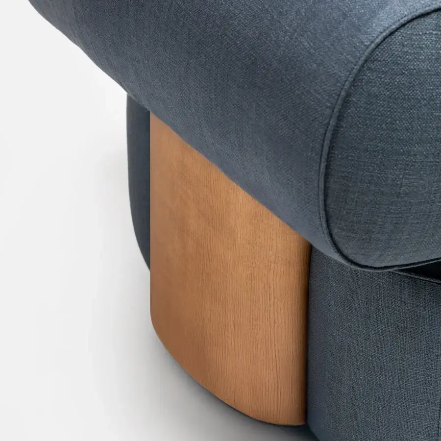 Elegant Carpanese Home Slow P lounge chair with muted blue fabric upholstery and visible ash wood structure