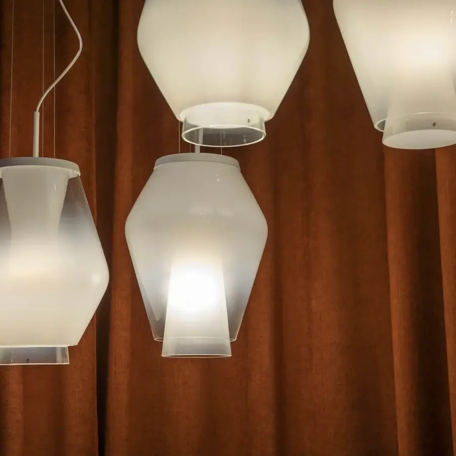 Elegant Vistosi Anisette suspension lamp crafted in Italy with superimposed shaded white crystal diffusers and adjustable stem