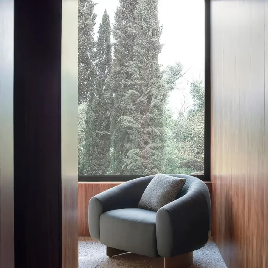 Captivating Carpanese Home Betty lounge chair with smooth gray-blue textile upholstery and brass-toned base