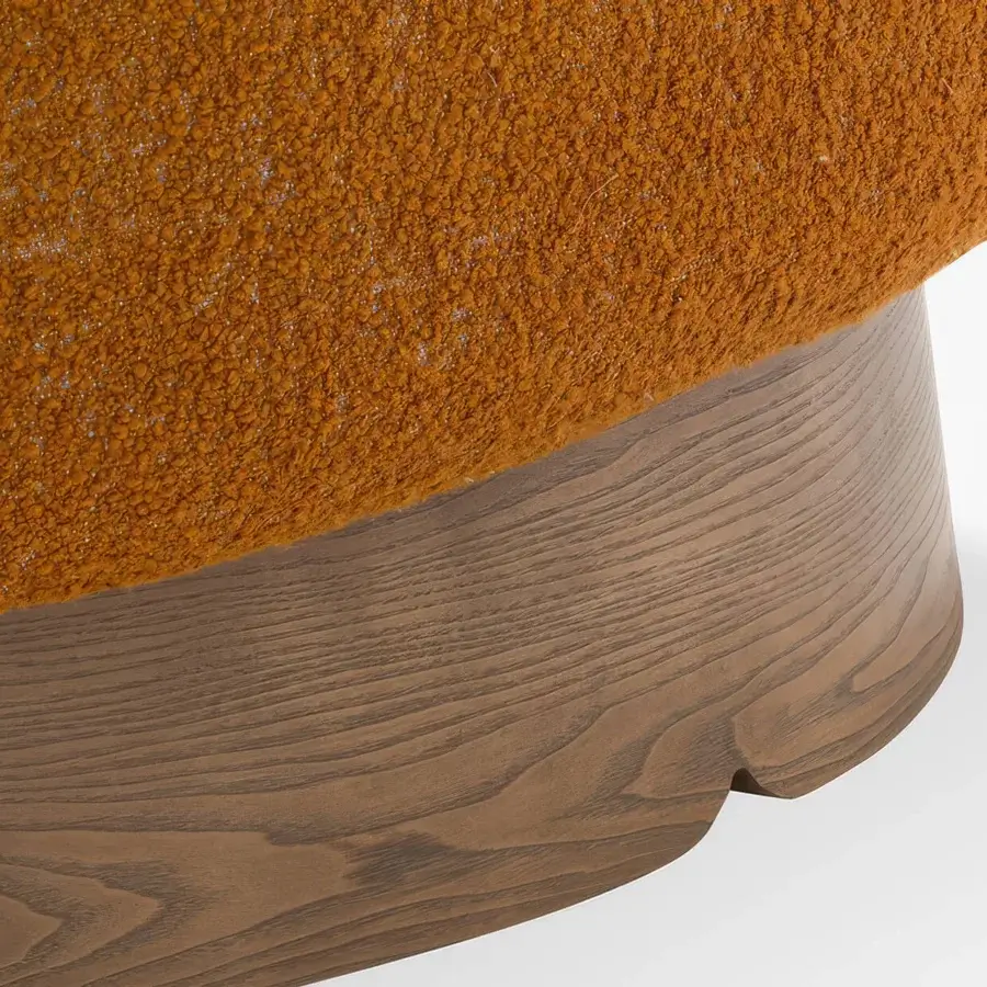 Lavish Carpanese Home Betty lounge chair in warm orange bouclé textile with a satin finished wood base