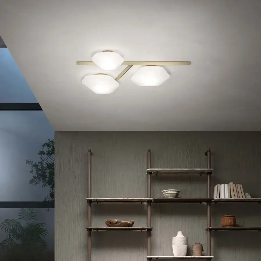 Elegant Vistosi Modulor ceiling lamp crafted in beveled glass with a warm-toned brass finish exhibiting a symmetrical composition