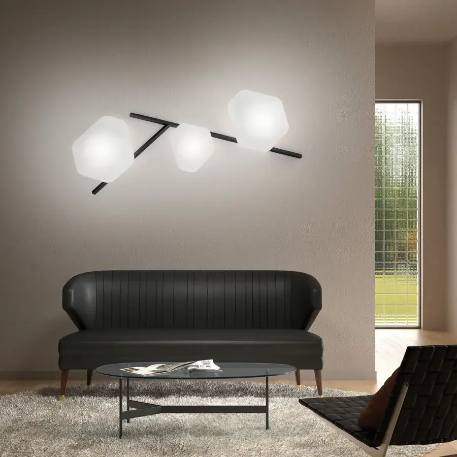 Elegant Vistosi Modulor wall lamp with beveled white glass geometries and a discreet matte black metal frame