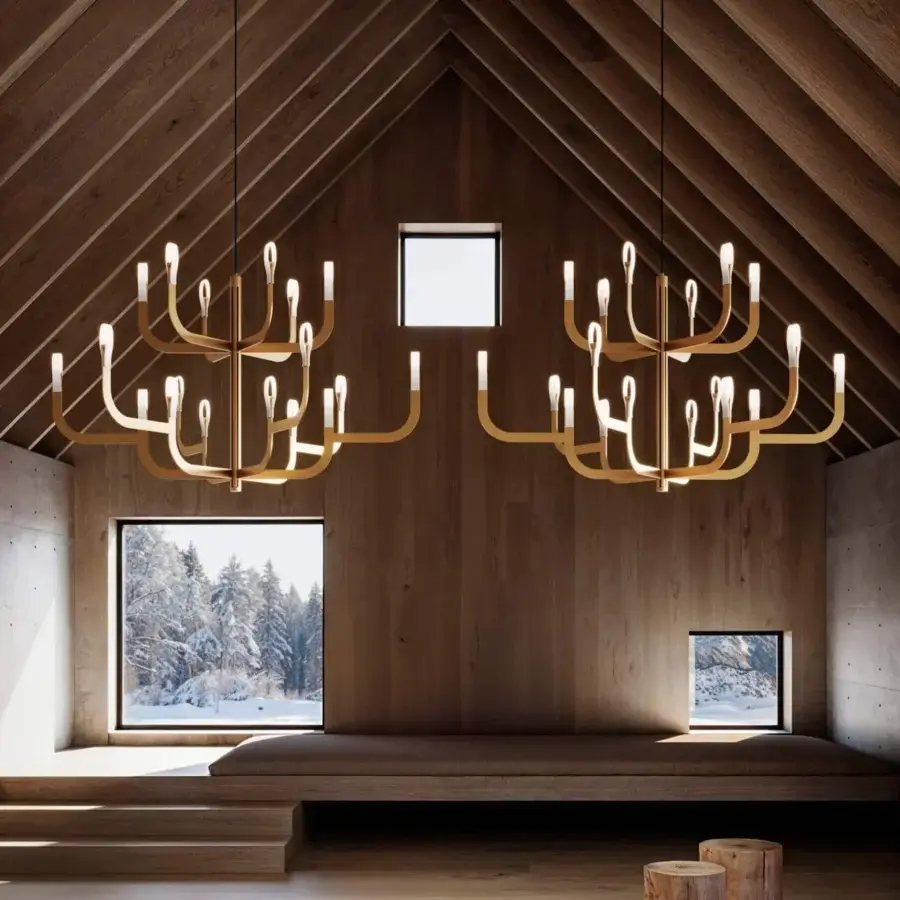Superior Luceplan J-Us chandelier built in layered materials and metal with a warm brassy gold finish