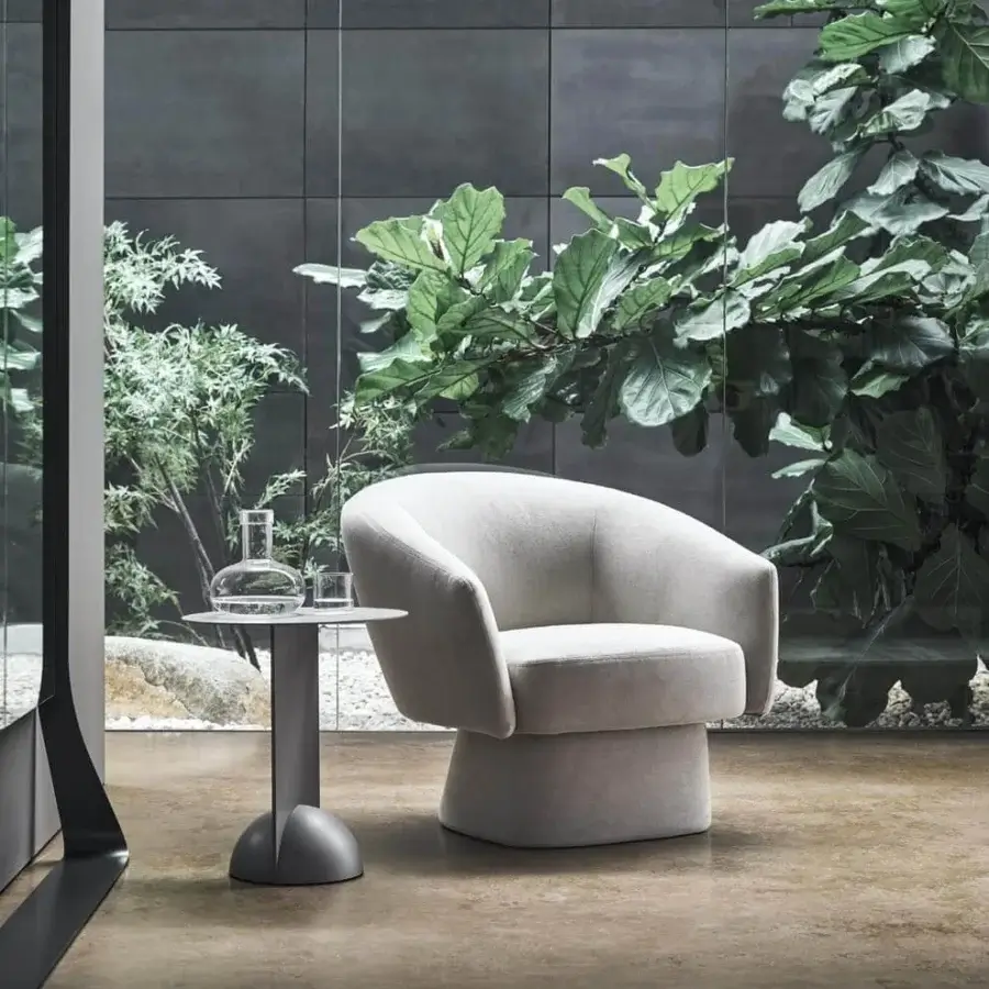 Sophisticated Bonaldo Bruno lounge chair with generous padding and light beige fabric upholstery exhibiting a matte finish
