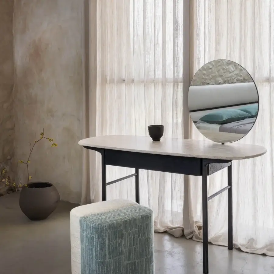 Sophisticated Carpanese Home Rocha ottoman built with striated blue-grey fabric and a sculpted plywood structure