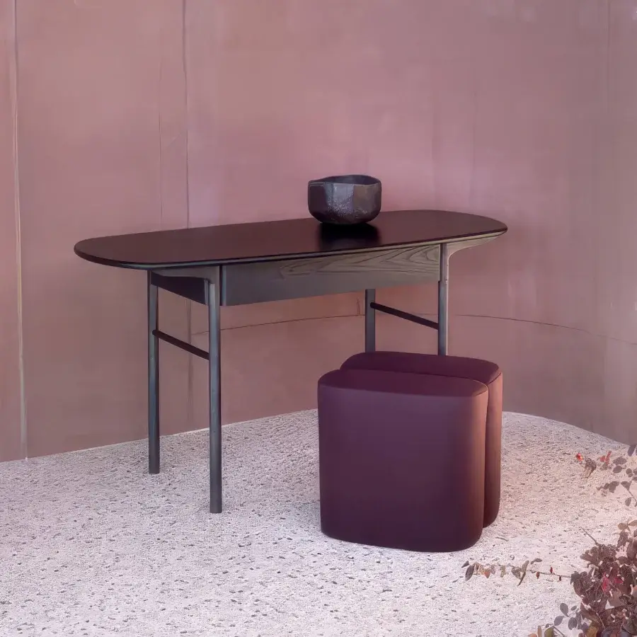 Distinguished Carpanese Home Rocha ottoman crafted in plum fabric with satin finish and resilient structure