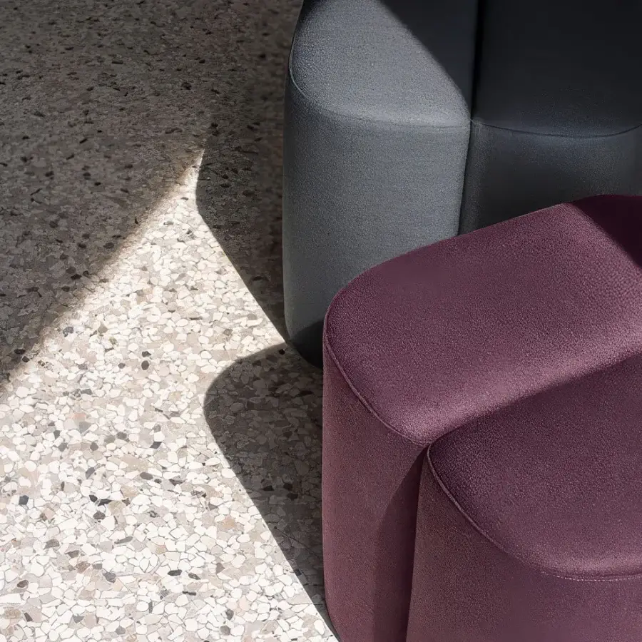 Exceptional Carpanese Home Rocha ottoman built with gray textile and burgundy upper section in a textured matte finish