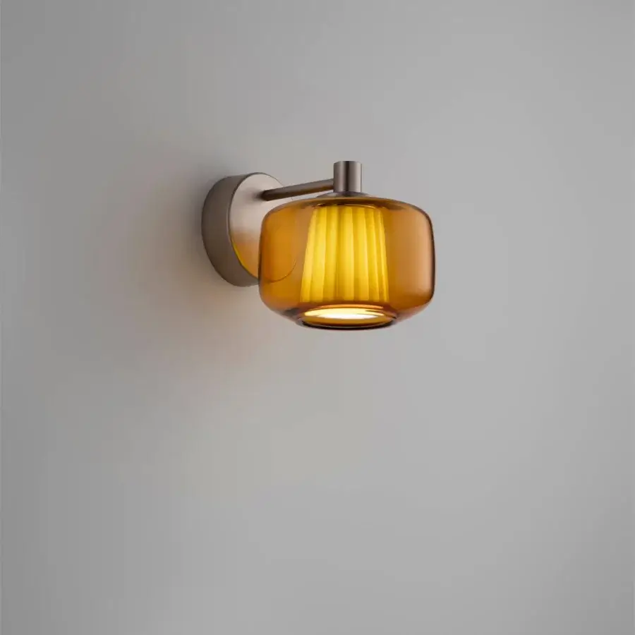 Elegant Vistosi Plissé wall lamp with sinuous blown glass diffuser and concealed fabric lampshade in amber tones
