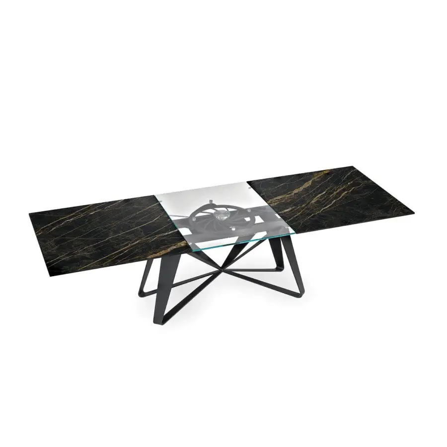 Innovative Naos Flocon extendable dining table with dark marbled material, gold veining and a clear glass center in matte black painted steel