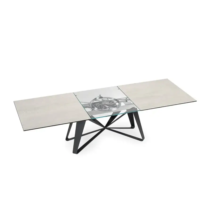 Superior Naos Flocon extendable dining table with textured light gray ceramic and clear glass tabletop, built upon a matte black painted steel base