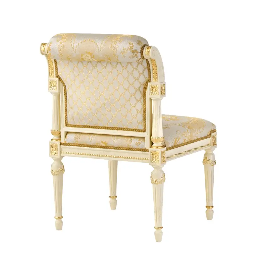 Distinguished Modenese Golden Radiance chair crafted with delicately carved wood and hand-applied gold detailing in cream and gold fabric