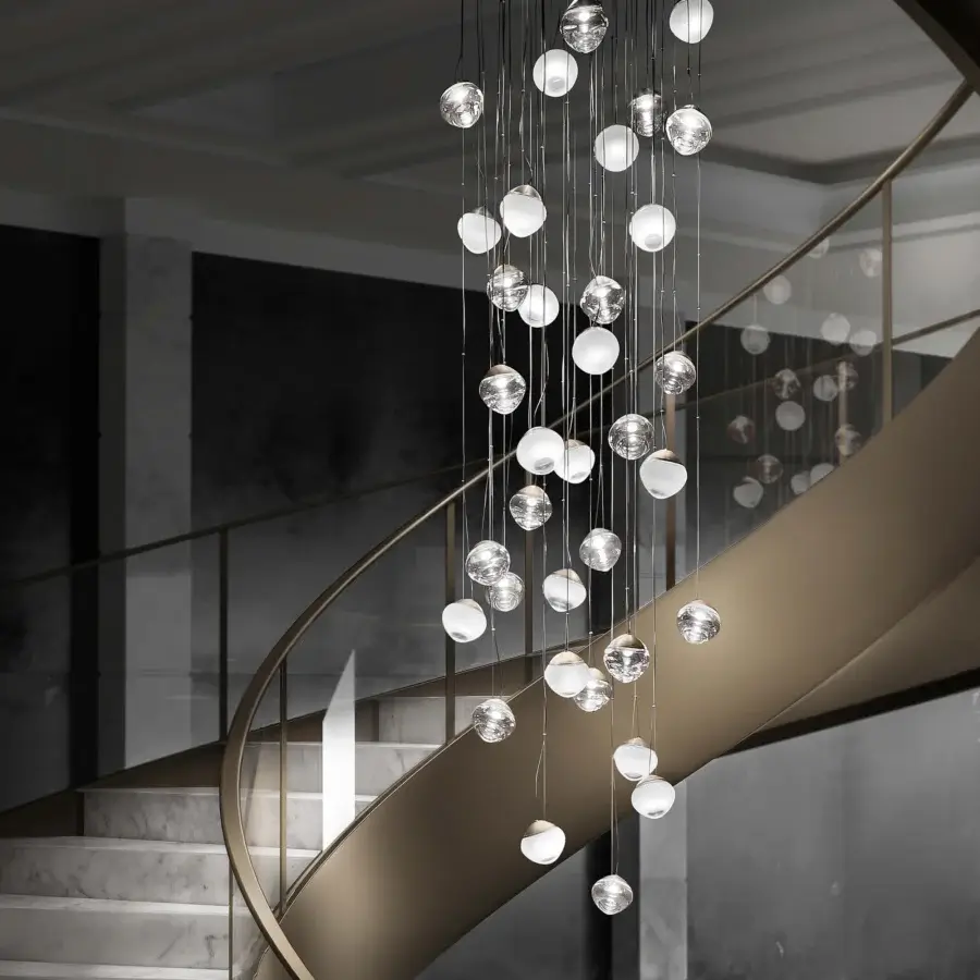 Distinguished Vistosi Pure suspension lamp crafted in clear glass with a silver-toned metal structure and elongated curved form