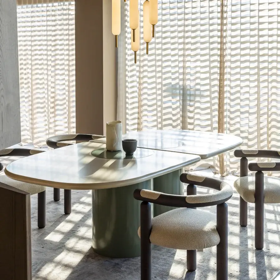 Distinguished Carpanese Home Ladybug table crafted in ash wood with pale off-white lacquered tabletop and oval silhouette