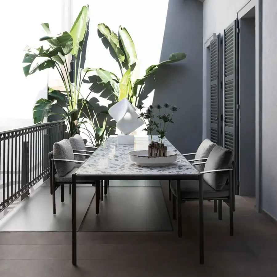 Elegant Giorgetti Aldìa armchair with a sleek metal frame and sculptural birch plywood built in textured gray and white waterproof fabric