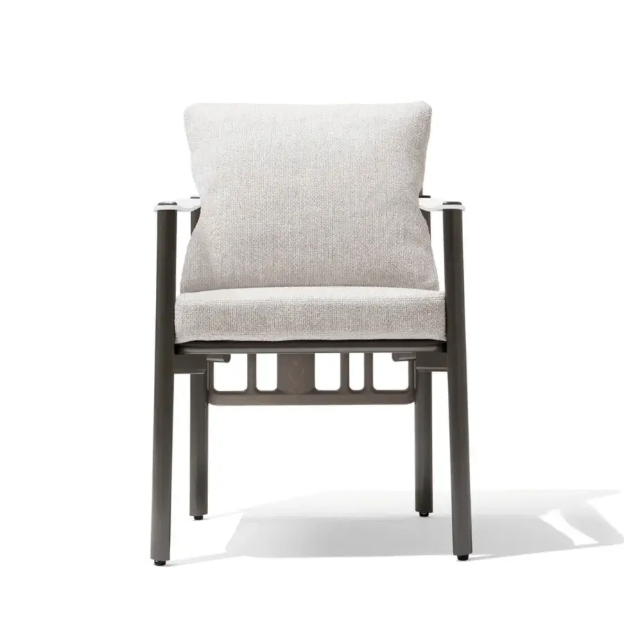 Distinguished Giorgetti Aldìa armchair with a sleek metal frame and sculptural birch plywood details upholstered in waterproof light beige fabric