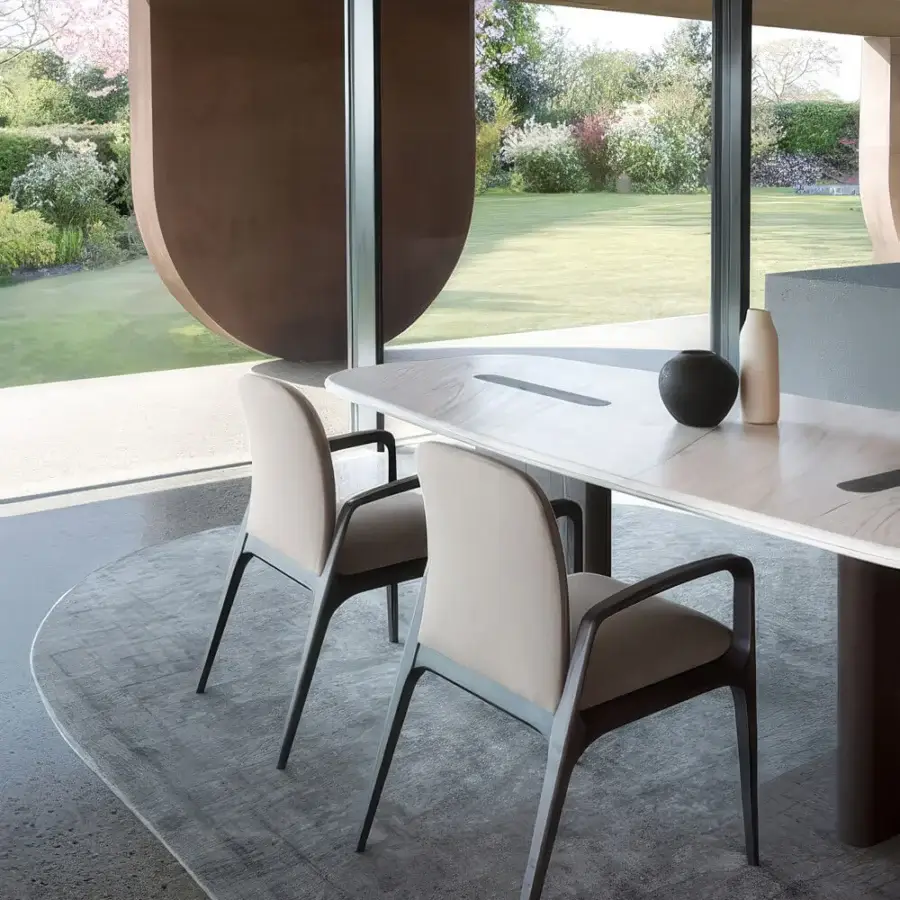 Superior Carpanese Home Linea T table with neutral ash wood tabletop and lacquered curved supports delivering a minimalist aesthetic