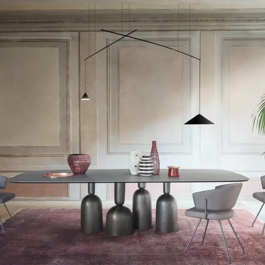 Distinguished Bonaldo Cop table with a dark gray wood tabletop and stylized painted metallic base elements