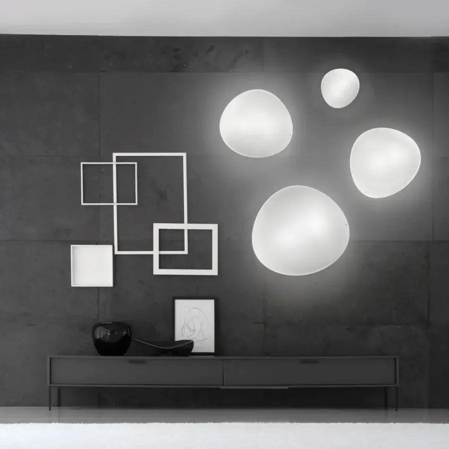Exceptional Vistosi Balance wall lamp crafted in hand-blown glass with a smooth matte finish and elliptical shape