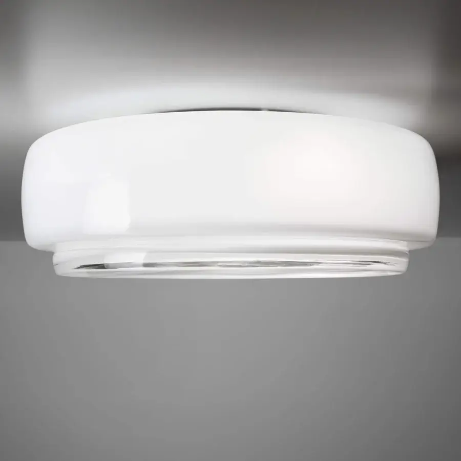 Elegant Vistosi Bot ceiling lamp crafted with glossy white glass accented by a sleek chrome band radiating inviting light