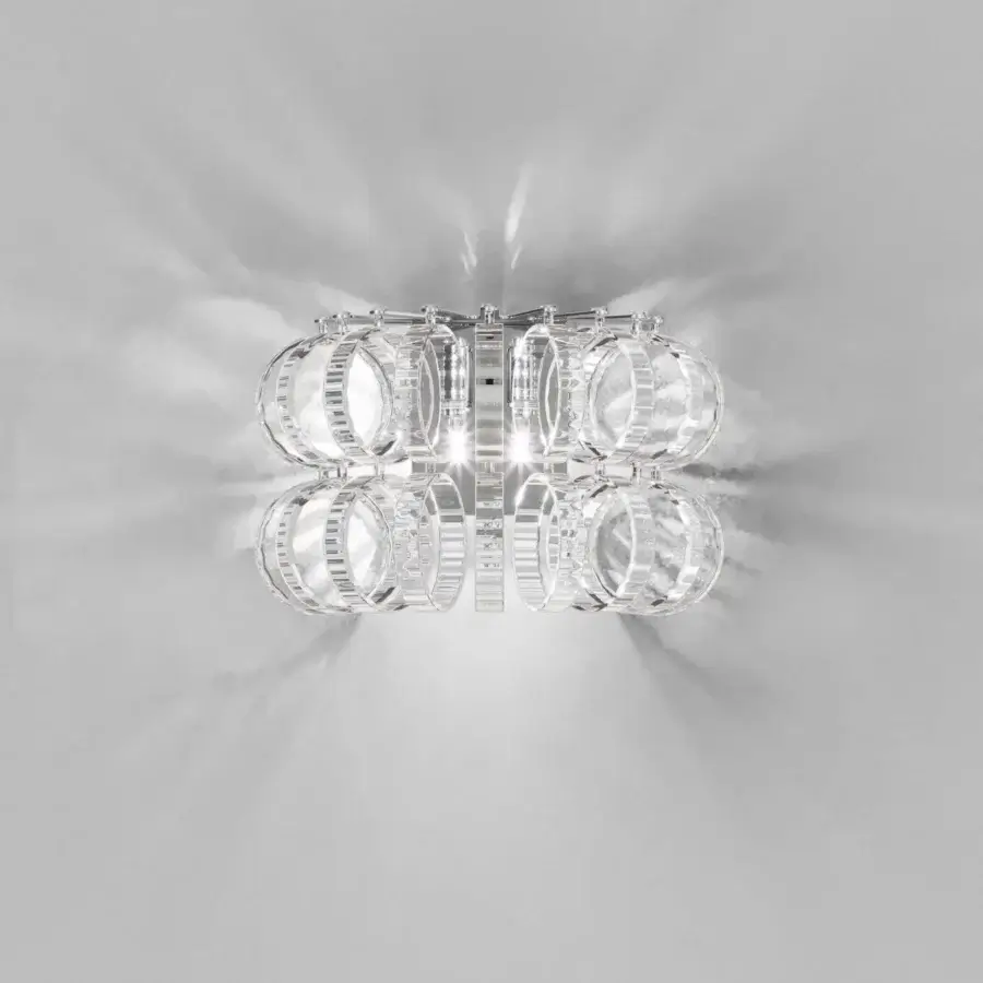 Elegant Vistosi Ecos wall lamp crafted in ridged clear glass and metal with subtle gray reflections