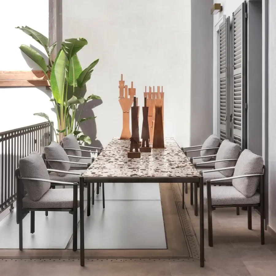 Exceptional Giorgetti Aldìa table with a mosaic tabletop in varied brown and beige stone and a dark gray metal base