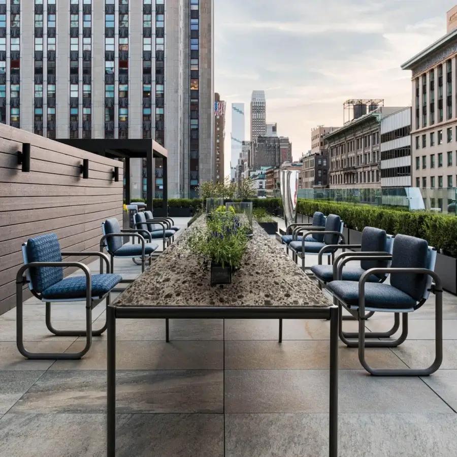 Refined Giorgetti Aldìa table with a textured synthetic tabletop and matte dark gray metal frame