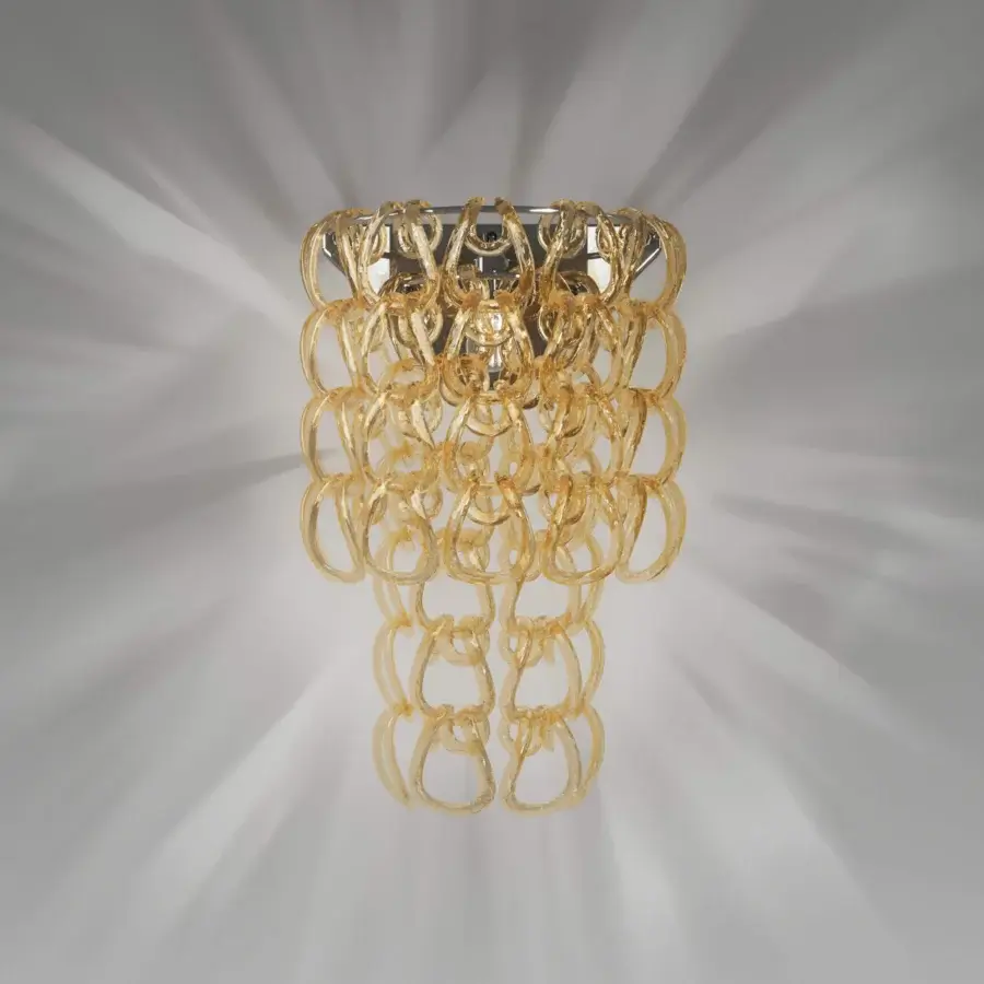 Exceptional Vistosi Giogali wall lamp crafted with interconnected Murano glass rings in warm amber and gold tones with a polished metallic mounting plate