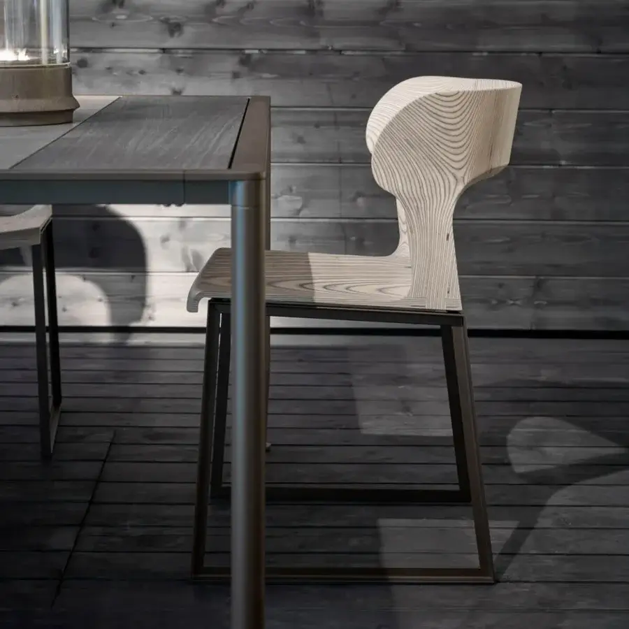 Elegant Giorgetti Gea chair crafted with a geometric stainless-steel frame powder-coated in carob and birch plywood seat with a matte finish