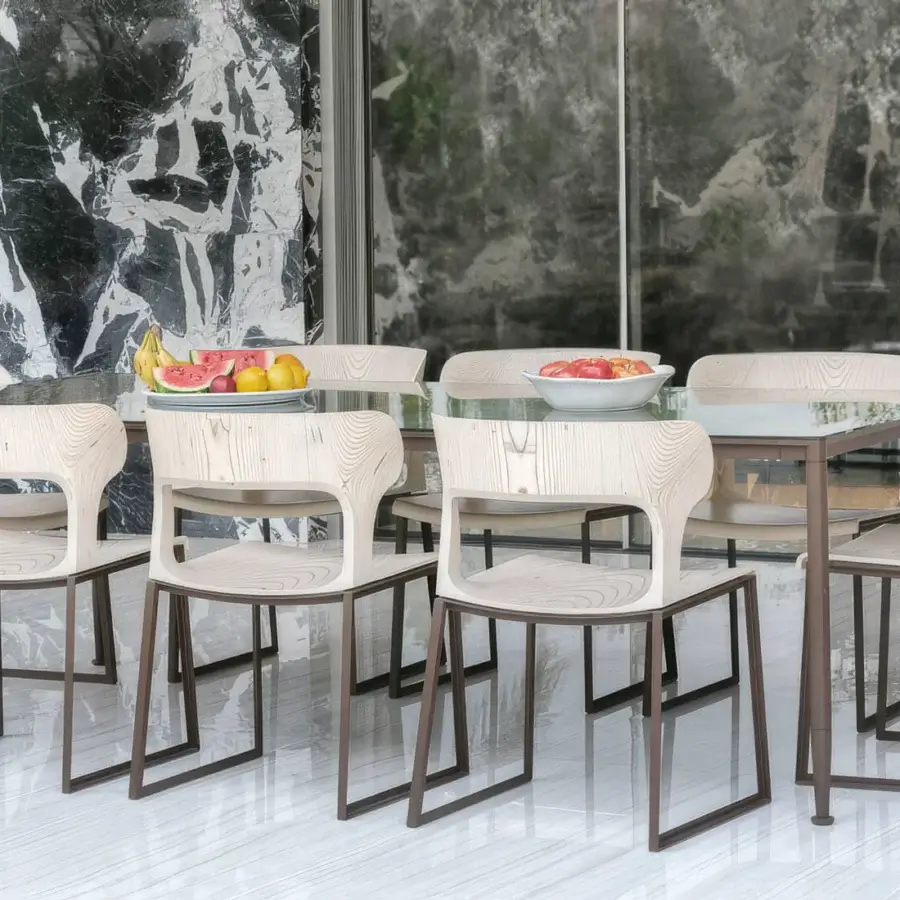 Captivating Giorgetti Gea chair with a geometric stainless-steel frame powder-coated in carob and beautifully grained birch plywood seat