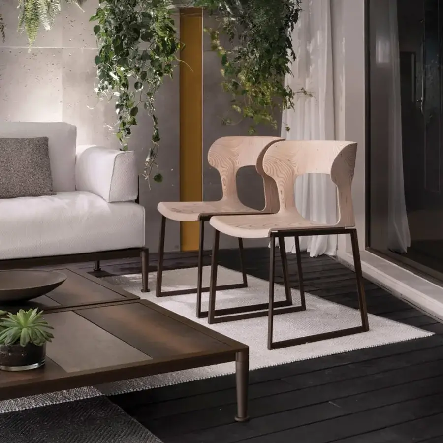 Elegant Giorgetti Gea chair with a geometric stainless-steel frame powder-coated in carob and refined birch plywood seat with a pale beige satin finish
